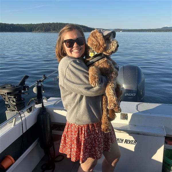 Mrs. Skoog on a boat with dog, Winston